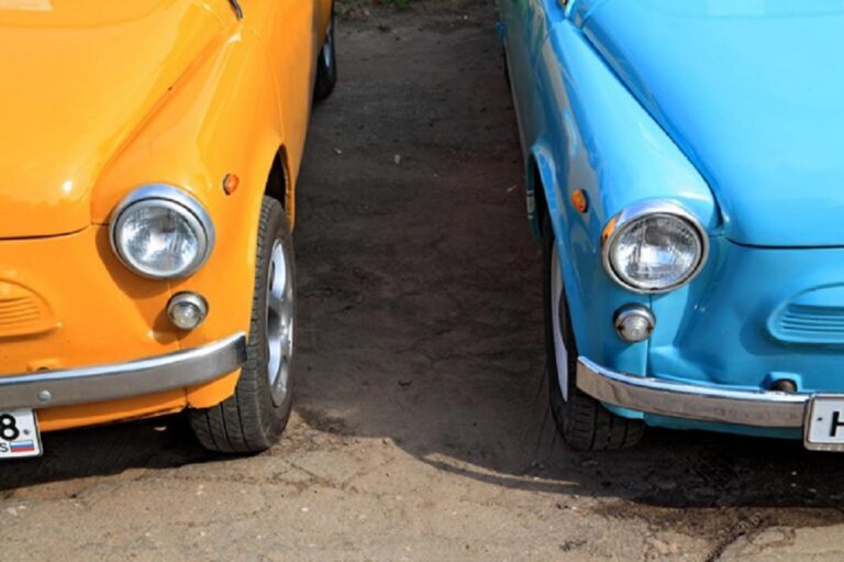 A close up of two retro cars