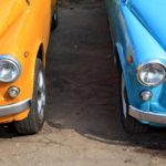 A close up of two retro cars